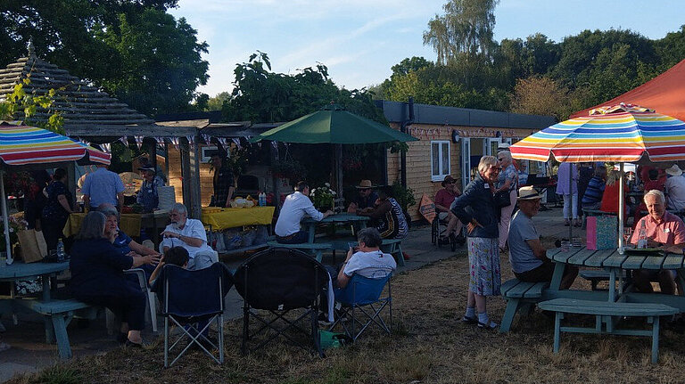 Photo of a BBQ event, pictured at early evening