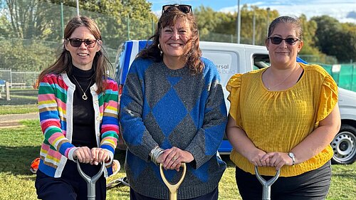 Cllrs Debbie Mickelburgh, Sarah Conboy, and Jo Harvey using shovels in a groundbreaking ceremony