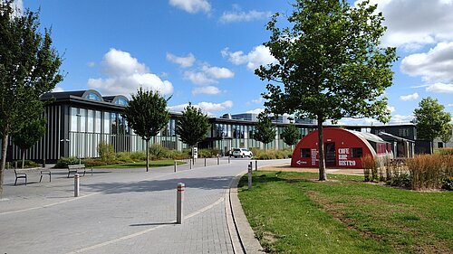 New_Shire_Hall_wideshot_taken_by_Nathan Photo of the exterior of New Shire Hall, Alconbury Weald