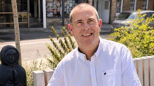 Ian Taylor sat on a bench